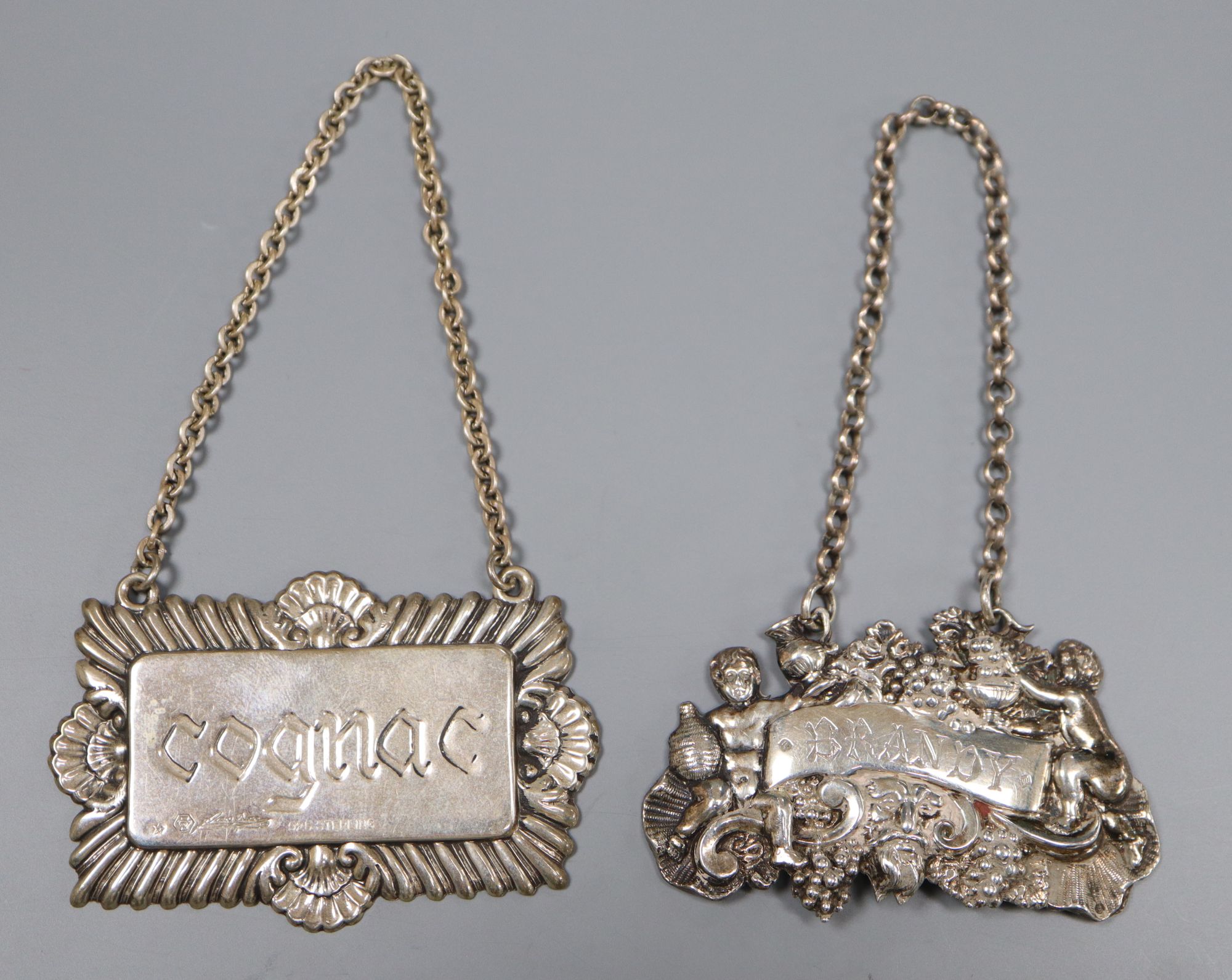 A William IV silver Brandy wine label, Joseph Wilmore, Birmingham, 1831, 59mm & a modern sterling Cognac label.